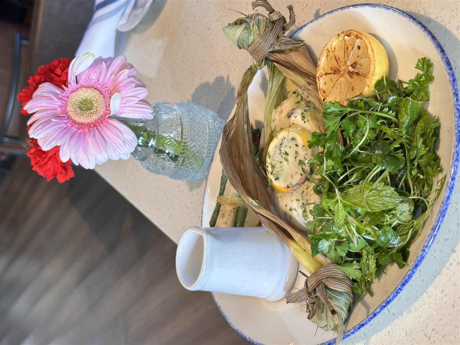Channel Islands halibut en papillote with herb salad and vegetables